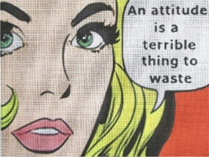 Pop-art illustration of a woman's face with green eyes and yellow hair; speech bubble reads, "An attitude is a terrible thing to waste".