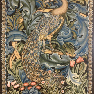 Decorative tapestry showing a peacock perched among stylized blue and green foliage and pink flowers, bordered by a woven edge.