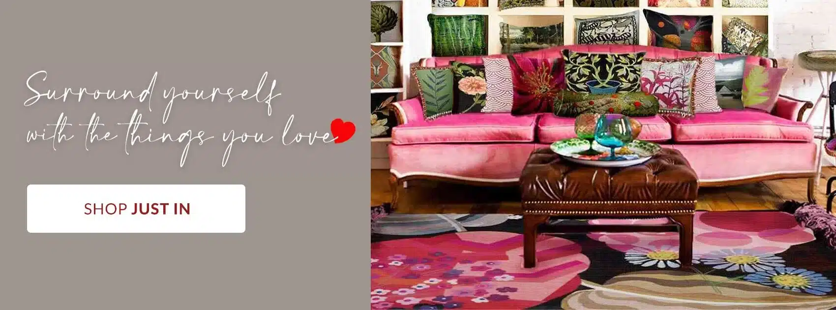 Advertisement banner featuring a pink velvet sofa with colorful cushions on the right and a gray panel with a 'Shop Just In' CTA on the left.