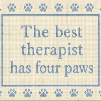 Cross-stitch sign that reads 'The best therapist has four paws,' surrounded by blue paw prints.